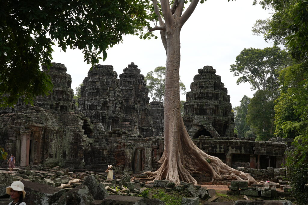 The weathered towers and galleries of Banteay Kdei under a bright sky