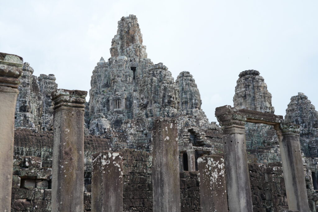 Serene carved stone faces on the upper towers of Bayon