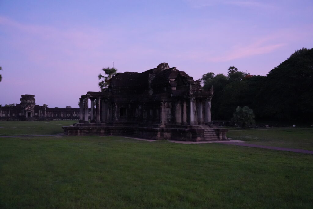 The north library building beneath a violet and pink dawn sky