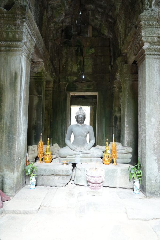 Buddha shrine with gold offerings