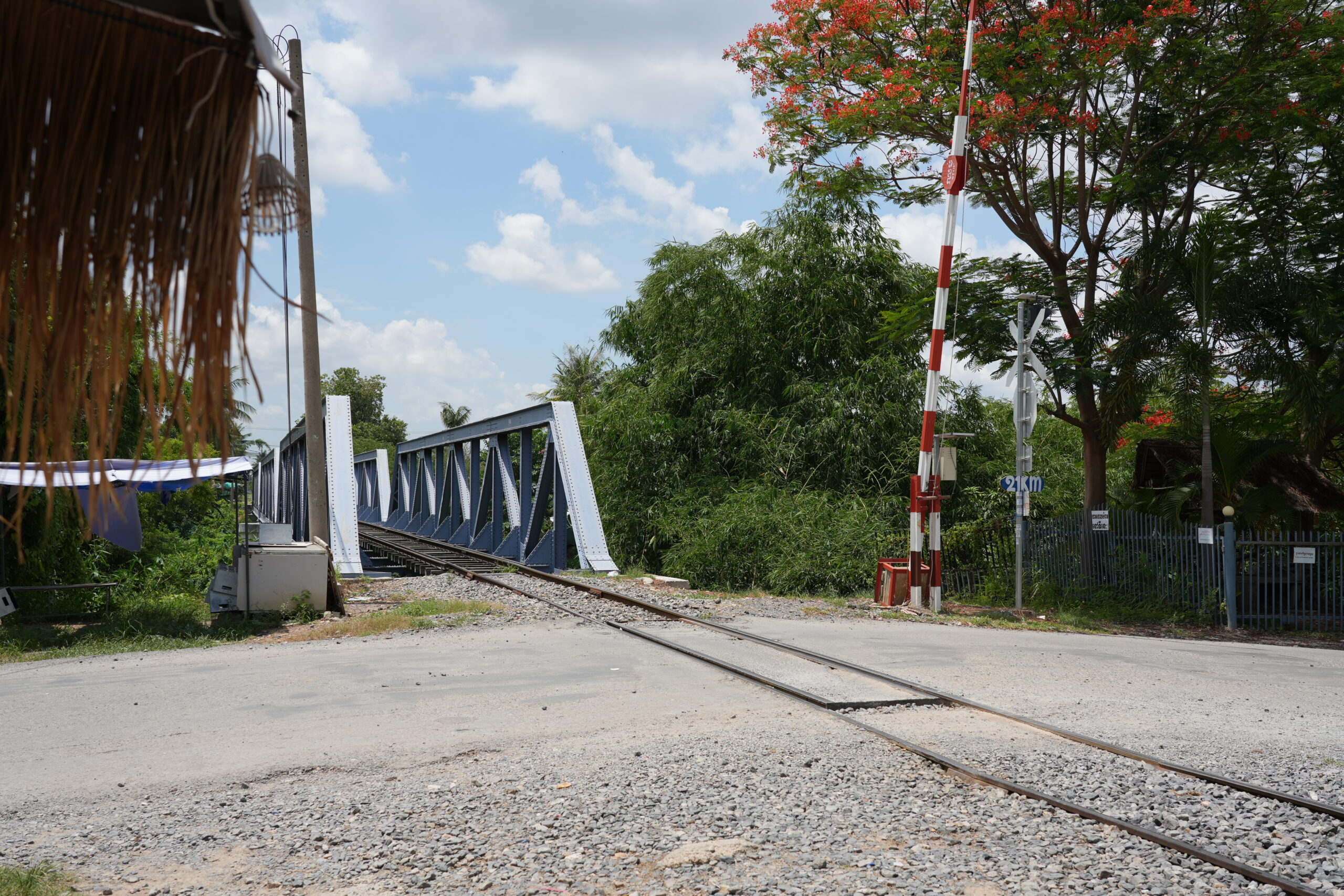 Bridge and crossing barrier