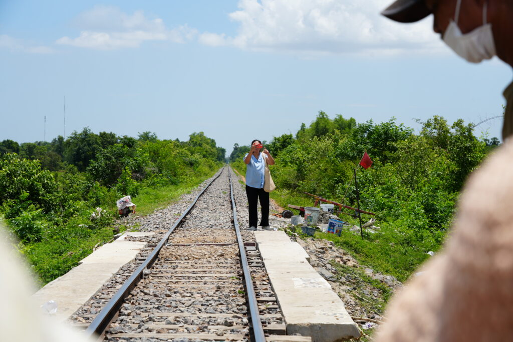 Woman photographing on the tracks