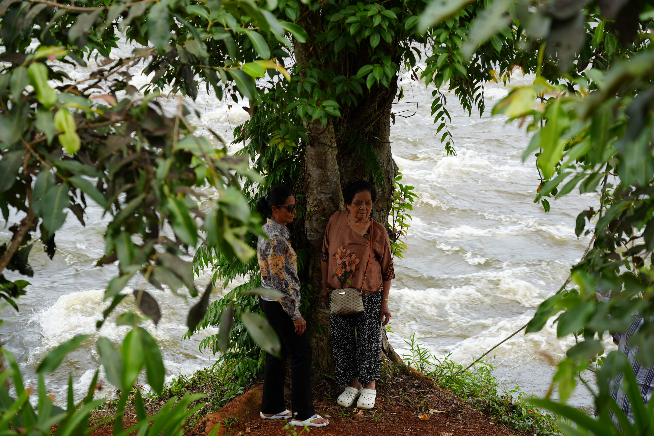 Women by whitewater rapids