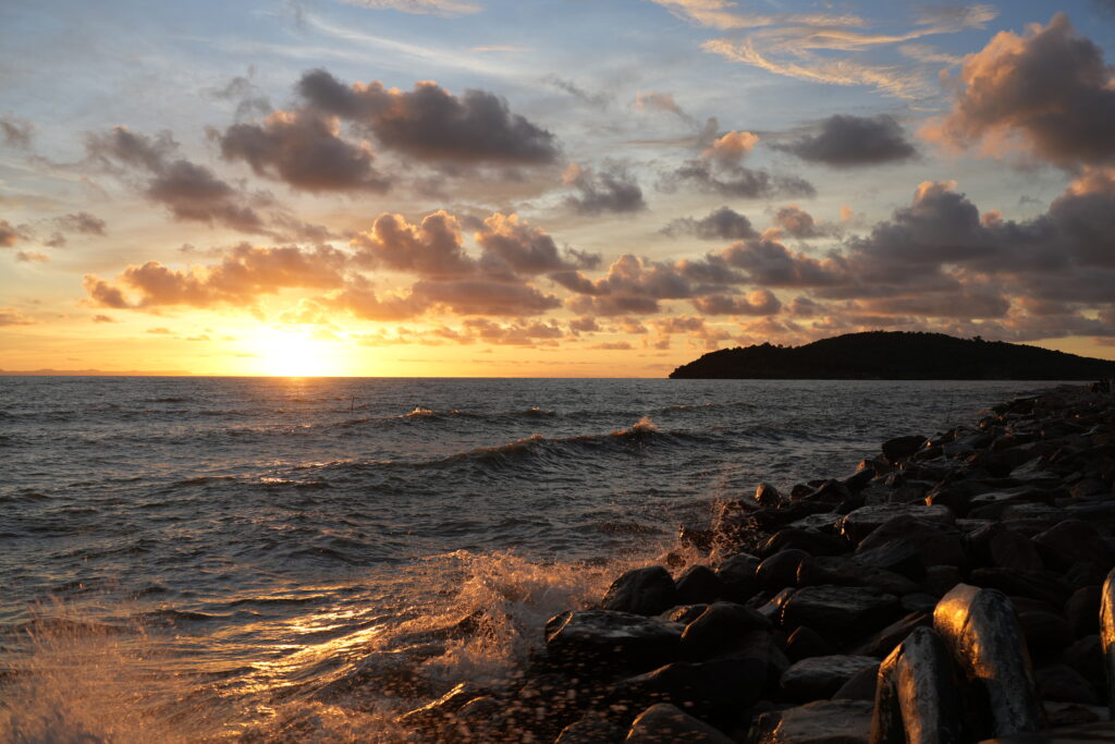 Kep coast golden-hour surf