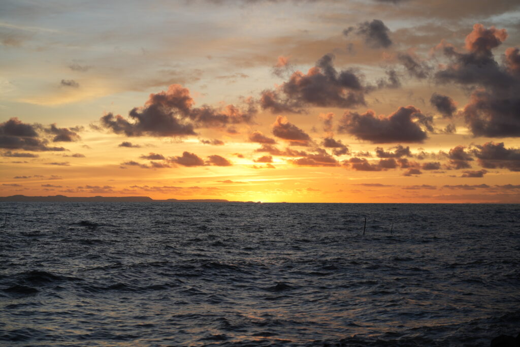 Coastal sunset with cloud drama