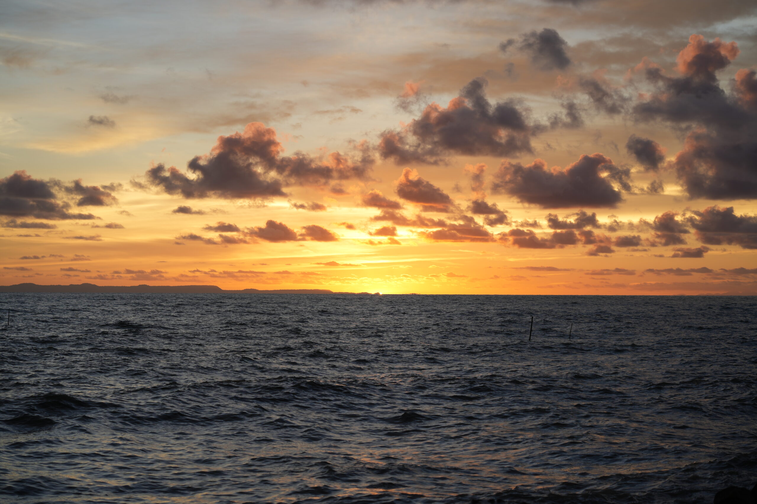 Coastal sunset with cloud drama