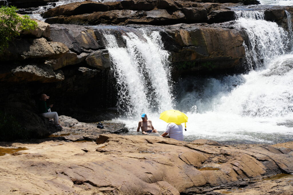 Yellow umbrella at falls