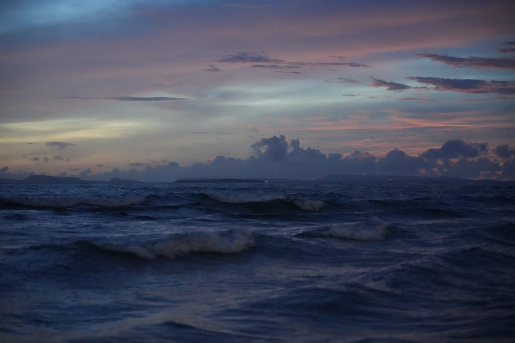 Surf and pink dusk sky