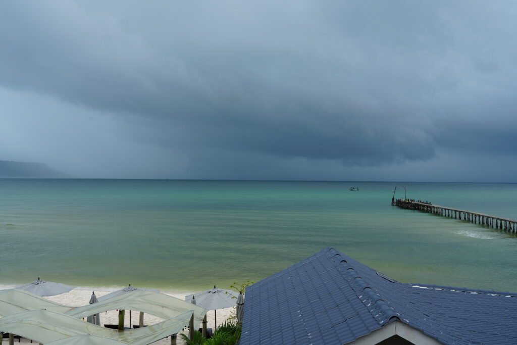 Storm front over turquoise bay