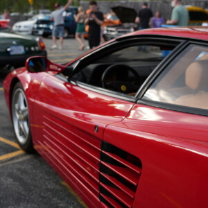 The side strakes and rear haunch of a red Ferrari Testarossa