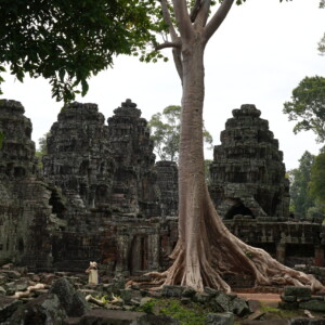 The weathered towers and galleries of Banteay Kdei under a bright sky