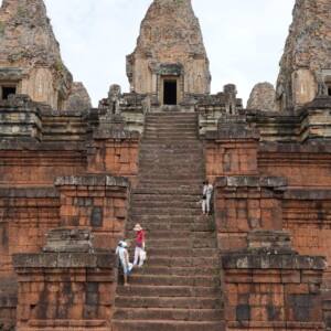 Visitors climbing the steep laterite stairway of Pre Rup temple