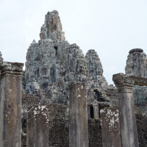 Serene carved stone faces on the upper towers of Bayon