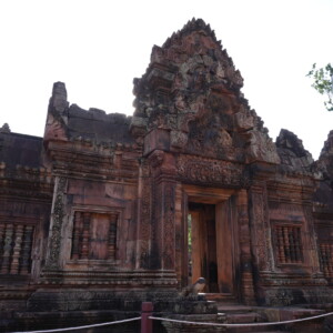 The rose sandstone facade and carved pediments of Banteay Srei