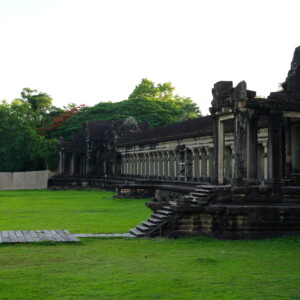 Angkor Wat's outer gallery and lawn under early morning sun